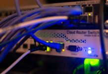 गम्भीर PHP सुरक्षा कमजोरीपछि केही सरकारी वेबसाइट अस्थायी रूपमा बन्द Network cables connected to computer networking equipment, illustrating digital infrastructure and cybersecurity