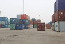 Stacks of shipping containers at Birgunj Dry Port, Nepal, illustrating the country's merchandise trade and logistics network.