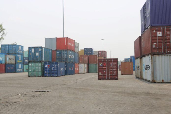 Stacks of shipping containers at Birgunj Dry Port, Nepal, illustrating the country's merchandise trade and logistics network.