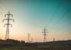 High-voltage electricity transmission towers and power lines, representative image for the Kaligandaki Corridor transmission line restoration story