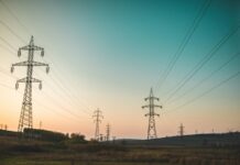 High-voltage electricity transmission towers and power lines, representative image for the Kaligandaki Corridor transmission line restoration story