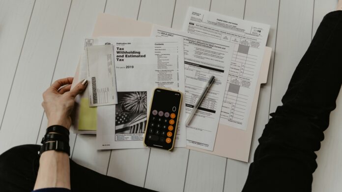 Budget documents and calculator — representative finance image Budget papers, calculator and financial documents on a desk, representing public spending analysis